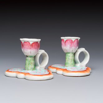 A pair of Chinese export famille rose lotus-form chambersticks on ruyi-shaped bases, Qianlong