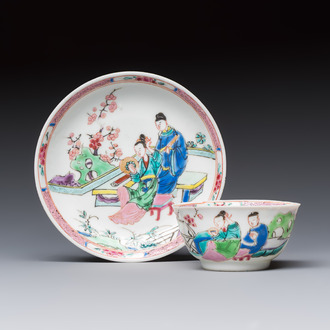 A fine Chinese famille rose cup and saucer with a couple on a terrace, Yongzheng/Qianlong