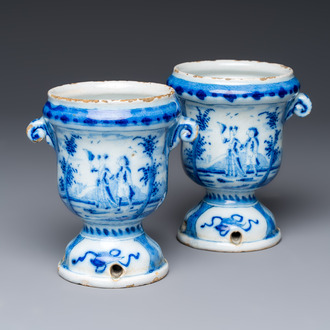 A pair of small blue and white Dutch Delft urn-shaped hyacinth vases, 18th C.