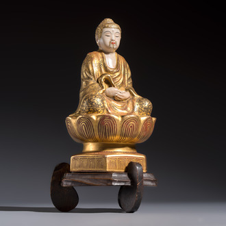 A Japanese Satsuma figure of Buddha seated on a lotus base, Hododa 保土田 mark, Meiji, 19/20th C.