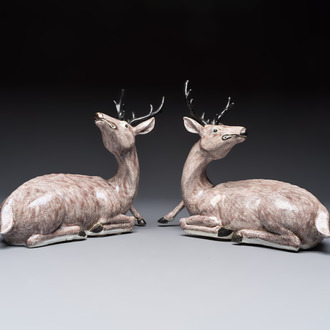 A pair of Chinese aubergine-glazed models of recumbent deer, 18/19th C.