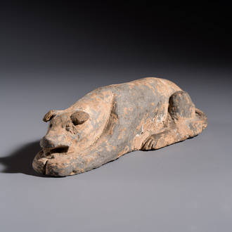 A Chinese grey pottery model of a reclining dog, Han