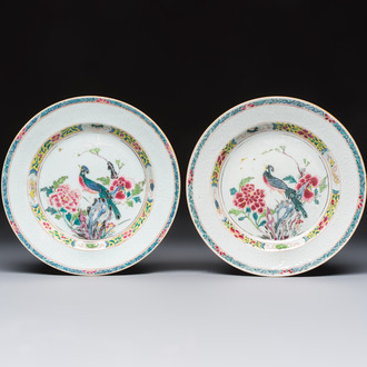 A pair of Chinese famille rose 'Peacock and Flowers' plates, Yongzheng