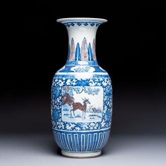 A Chinese blue, white and copper-red 'Deer' vase, 19th C.