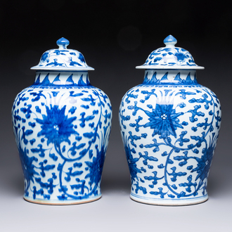 Two Chinese blue and white 'Lotus Scroll' vases and covers, Kangxi