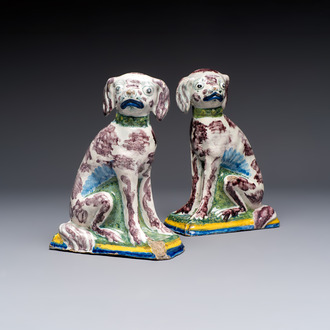 A pair of polychrome Dutch Delft money banks modelled as dogs, 18th C.