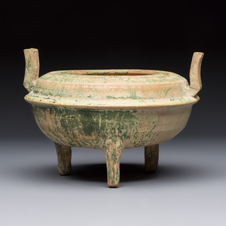 A Chinese green-glazed pottery ritual tripod food vessel with handles, 'Ding 鼎', Han