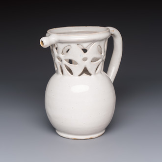 A French white-glazed puzzle jug, Nevers, 18th C.