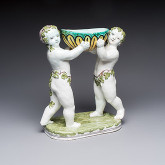 A French polychrome faience group with two Bacchus figures, Geo Martel, Dèsvres, early 20th C.