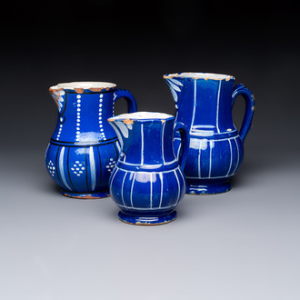 Three blue-ground faience jugs, probably Saint-Omer, North of France, 18/19th C.