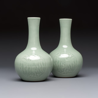 A pair of Chinese celadon-glazed bottle vases with incised phoenix design, Yongzheng mark, 19th C.