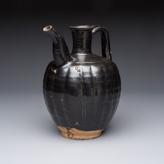 A Chinese Yaozhou black-glazed ewer with a ribbed body, Song