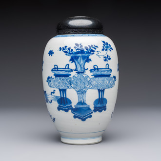 A Chinese blue and white ovoid 'Antiquities' jar with a wooden cover, Kangxi