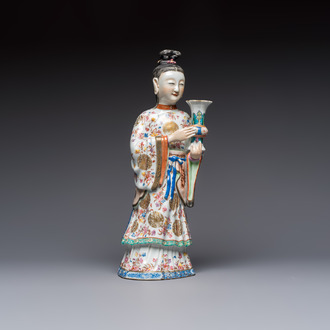 A Chinese famille rose candle holder in the shape of a court lady holding a 'Gu' vase, Qianlong