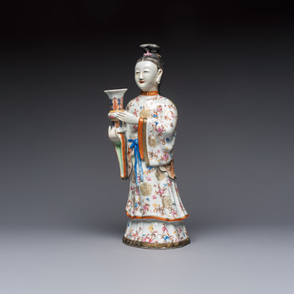A Chinese famille rose candle holder in the shape of a court lady holding a 'Gu' vase, Qianlong
