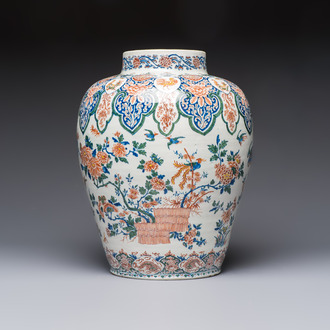 A large Dutch Delft cashmere palette vase with a phoenix and birds among flowers, ca. 1700