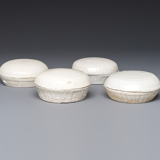 Four Chinese white-glazed boxes and covers with incised floral design from the Jepara shipwreck, Dehua or Anxi kiln, Song
