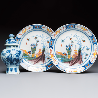 A blue and white Dutch Delft covered vase and two polychrome plates, 17/18th C.