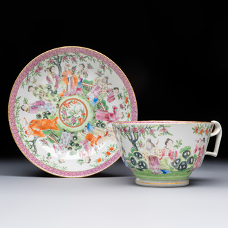 A Chinese Canton famille rose cup and saucer with figures in a garden, 19th C.