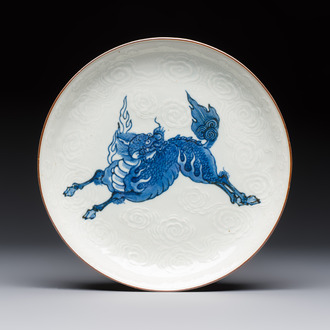 A Japanese Arita blue and white Kakiemon-style 'Kirin' plate with underglaze relief design, Edo, 18th C.