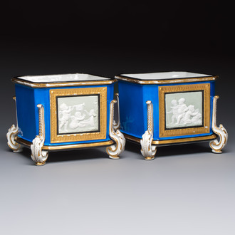 A pair of French gilt blue-ground 'Cherub' jardinières with biscuit-relief plaques, 19/20th C.