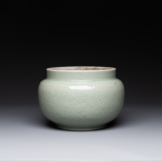 A Chinese celadon-glazed bowl with incised chilong among floral scrolls, Kangxi