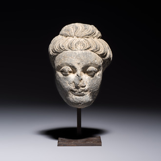 A Gandhara grey schist relief fragment of a Bodhisattva head, 3rd/4th C.