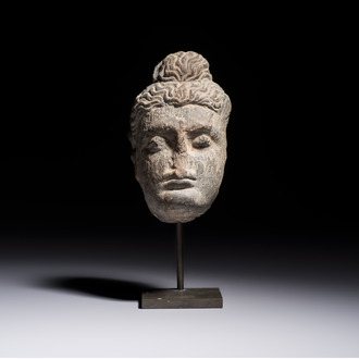 A Gandhara grey schist relief fragment of a Bodhisattva head, 3rd/4th C.