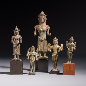 Five bronze figures of divinities, probably Cambodia, 12/13th C.