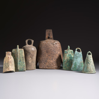 Seven various Chinese bronze and cast-iron bells, Han and later