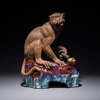 A Chinese polychrome-glazed Shiwan stoneware 'Monkey and Peach' group, signed, 20th C.