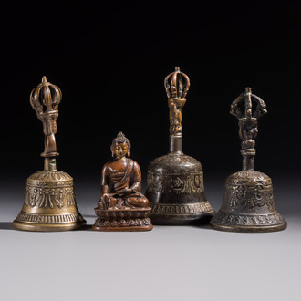 Three Tibetan bronze ritual bells and a bronze Buddha, 19th C.