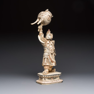 A Chinese polychromed carved bone figure of a warrior raising a tripod censer, 20th C.