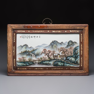 A framed Chinese famille rose 'Mountainous Landscape' plaque, after Wang Yeting 汪野亭, 20th C.
