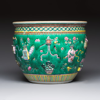 A Chinese famille rose green-ground 'Antiquities' fish bowl or jardinière with applied relief design, 19th C.
