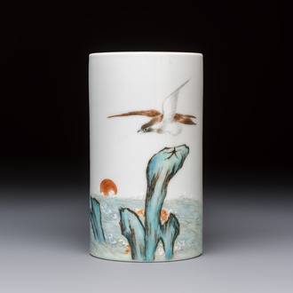 A Chinese polychrome brush pot with a bird standing on rockwork amid waves, Qianlong mark, 20th C.