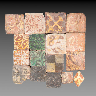 A varied collection of 17 slip-decorated medieval and post-medieval tiles, France and Flanders, 14/17th C.