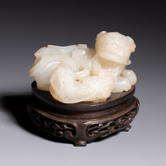 A Chinese carved jade 'Buddhist Lions' group, 19th C.