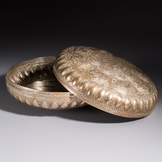 A Malay silver circular betel box and cover with floral design, 19th C.