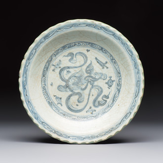 An unusual Chinese blue and white celadon-back 'Buddhist Lion' plate, Ming
