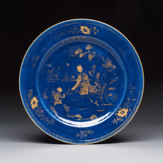 A Chinese gilt-decorated powder-blue-ground 'Elegant Beauty and Boy' dish, Kangxi