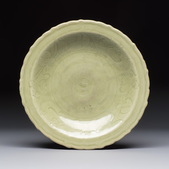 A Chinese Longquan celadon inscribed dish with incised floral design, Ming