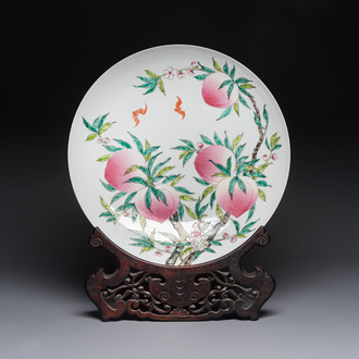 A Chinese famille rose 'Nine Peaches' dish on wooden stand, Yongzheng mark, 20th C.