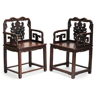 A pair of Chinese carved hongmu armchairs, 19th C.