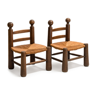 A pair of chairs in oak and straw, attributed to Charles Dudouyt, France, mid 20th C.