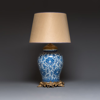 A large Chinese blue and white 'Lotus Scroll' baluster vase with later gilt-bronze lamp mounts, Kangxi
