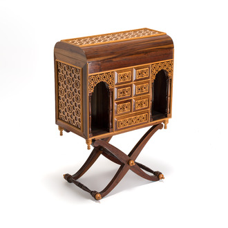A Moorish-style wooden chest on stand with mirrors and geometric patterns, 20th C.