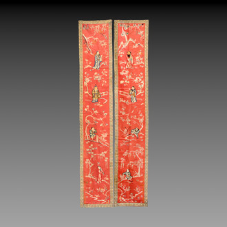 A pair of Chinese red-ground embroidered silk 'Eight Immortals' panels, 19th C.