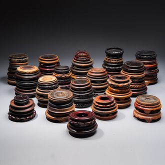 A collection of 75 Chinese wooden stands, 19/20th C.