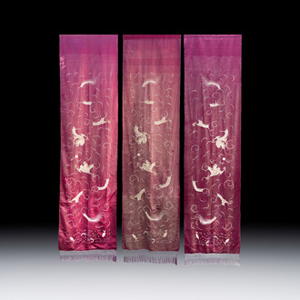 Three large Chinese purple-ground embroidered silk 'Dragons among Clouds' panels, 19th C.